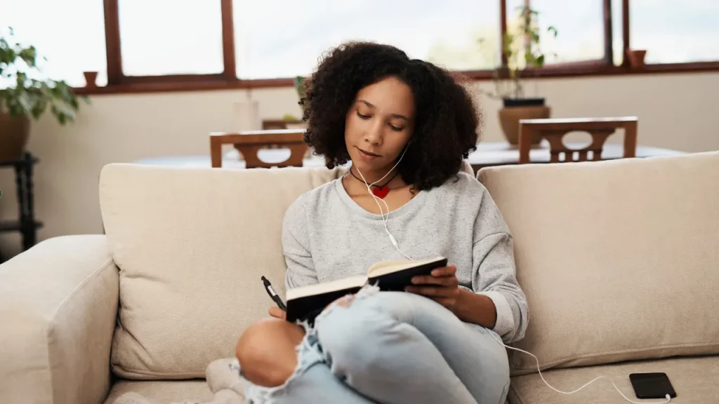 Girl writing on a notebook. 