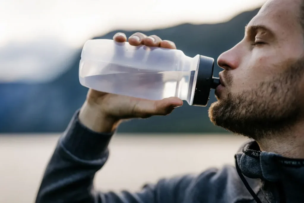 Man drinking water. 